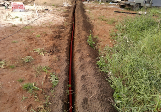 Laying cables in a trench